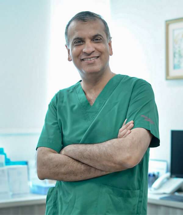 Dr. Manish Taneja in his uniform ready to treat his patients.